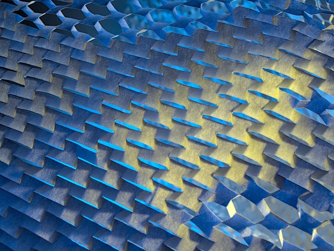 Paper Mesh - Illuminated by Blue & Yellow lights. This is protective packaging material that is too interesting to discard!